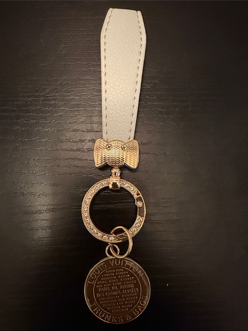 Inspired White Leather Strap Keychain with Brown Gold-Tone Medallion